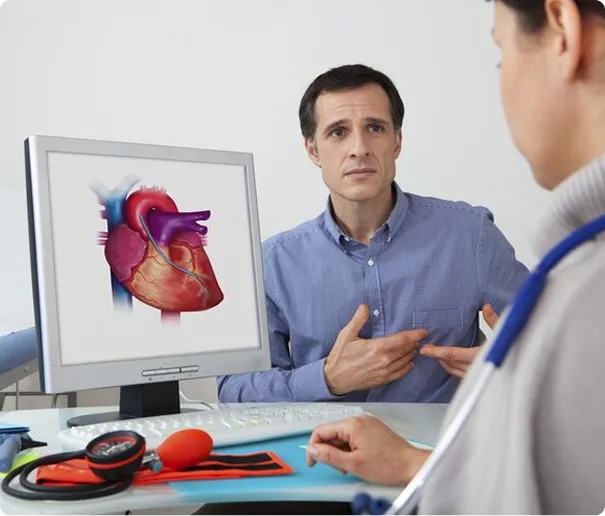 A cardiologist discussing a heart scan with a patient